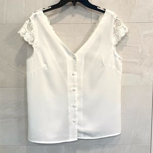 Double v neck line, button up front with lace and fabric button detailing